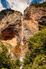 Rinka waterfall located in Logarska dolina national park in Slovenia, Second highest waterfall in Slovenia. Popular hiking destination in the Alps © Zedspider
