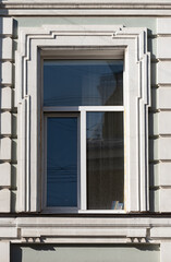 Windows on old city facades, with decorative elements