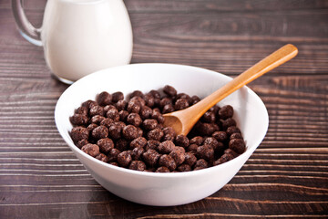 bowls with chocolate sweet corn balls. Delicious and healthy breakfast cereal.