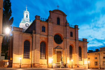 Obraz premium Stockholm, Sweden. Great Church Or Church Of St. Nicholas In Gamla Stan In Summer Evening. Famous Popular Destination Scenic Place In Night Lights. UNESCO