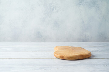 Empty table with wooden board over gray background. Cosmetic product display mock up for design