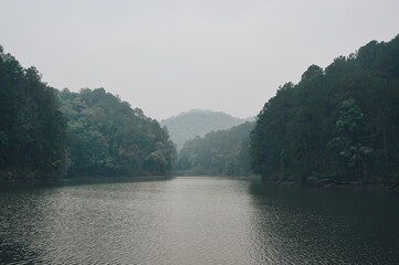 Fototapeta premium The lake in rainforest with haze ,north of thailand