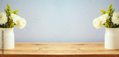 Empty wooden table over grey wall background.  Rustic kitchen interior mock up for design.