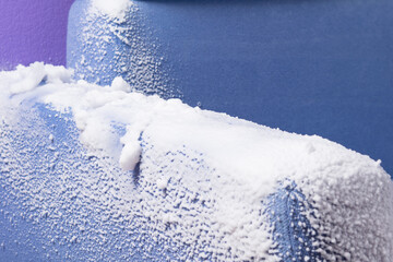 the armrest of the blue sofa, covered with thick foam for cleaning old dirt, close-up