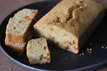 Slices of tutti frutti cake loaf made with whole wheat flour.