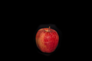 red apple of Royal Gala variety isolated on black background