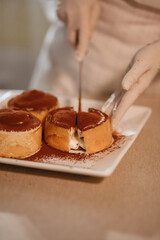 confectioner makes sweet delicious cakes at home. in bright colors