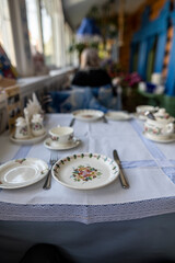 still life with food on a white plate on a white table on a sunny veranda 