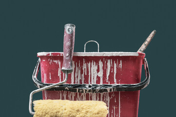 Paint roller and bucket with paint drops © stokkete