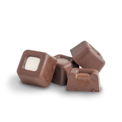 Group of organic cocoa truffles or candies made of dark chocolate in shape of squares isolated on white background