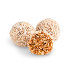 Three organic sweet nut truffles or vegan homemade energy balls made of hazelnut, walnut and sesame isolated on white background