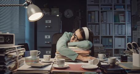 Exhausted office worker falling asleep in the office