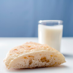 Close up still life with dairy products, yogurt and bread on a white background