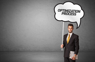 business person in casual holding road sign