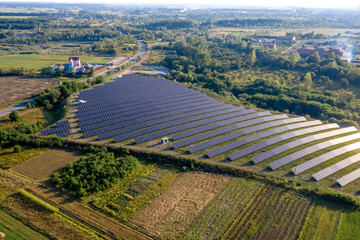 Fototapeta na wymiar Solar panels in aerial view. power farm producing clean energy.