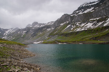 Naklejka na ściany i meble Beautiful swiss alps in summer with Glattalp lake.