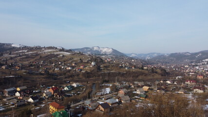 Drone shot. View of the village at the foot of the mountains. Carpathians. Ukraine.