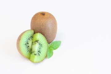Whole and halves kiwi fruits isolated on white background with text space