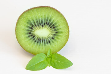 Fototapeta na wymiar Half kiwi fruit with leaf isolated on white background