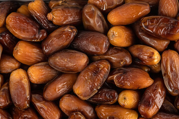 The surface texture of selected dried dates. Natural oriental sweets.