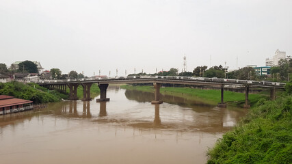Fototapeta na wymiar bridge over the Nan River of Phitsanulok Province Thailand