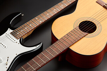 Fototapeta na wymiar Modern electric and retro acoustic guitars closeup