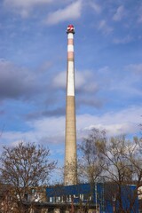 A view to the big chimney of the chemical factory with blue sky in background at Brno, Czech republic
