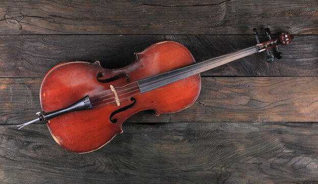 cello isolated on wooden background