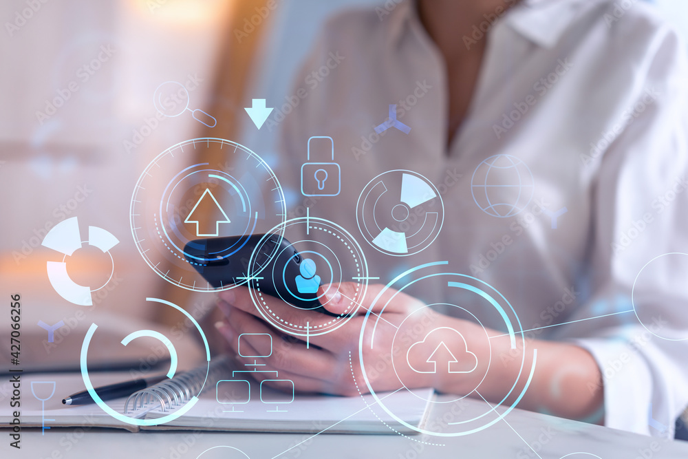 Poster businesswoman in formal wear holding in the hands a smart phone and testing an innovative applicatio