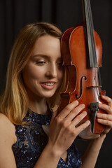 Female violonist with violin at her face