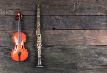 violin and clarinet isolated on wooden background