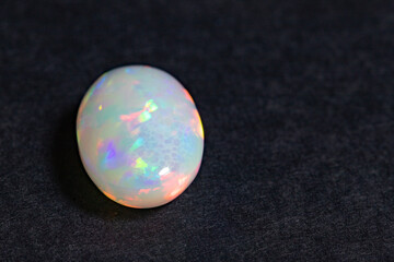 Opal gem close-up on a black background