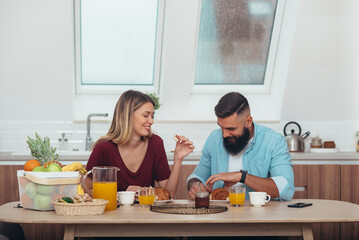 Couple having breakfast at home