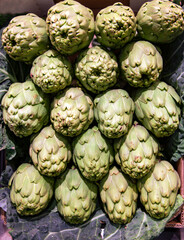 Fototapeta premium Fresh artichoke group on market. Healthy and vegetarian food concept. 