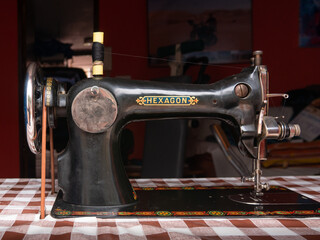 Antique Sigma hexagon sewing machine with details of its mechanical elements