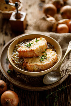 Traditional French onion soup baked with cheese croutons sprinkled with fresh thyme.