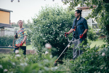 Two men are working in the garden.