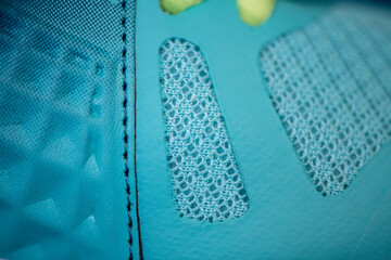 Fragment of women's sports sneakers, close-up.