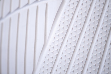 Fragment of women's sports sneakers, close-up.