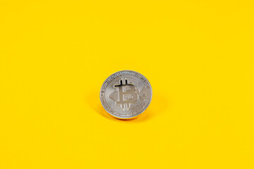 Photograph of bitcoin coins symbolizing the financial market of cryptocurrencies on a colored background and without people