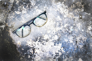 Clear eyeglasses, Glasses transparent dark blue frame Vintage style on grungy concrete cement floor...