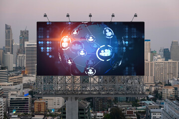 World planet Earth map hologram of social media icons over sunset panoramic cityscape of Bangkok, Southeast Asia. The concept of people connections.