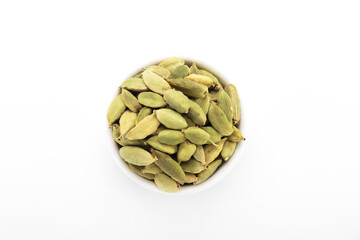 Fototapeta premium Cardamom, cardamom seeds, green cardamom. cardamom seeds in white bowl, on white background.
