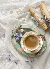 Romantic flat lay with vintage tray and a cup of coffee