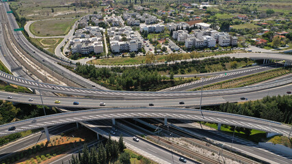 Aerial drone photo of multilevel highway intersection junction toll road outside city urban center