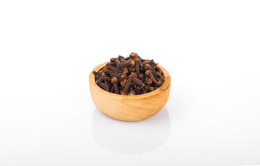 Clove, clove seed. Clove seed in wooden bowl,  on white background