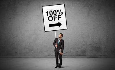 Obraz premium business person holding a traffic sign concept