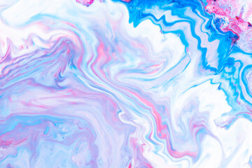 Fluid art. Abstract lilac pink background. Liquid marble texture design. Blue-pink pattern with liquid material