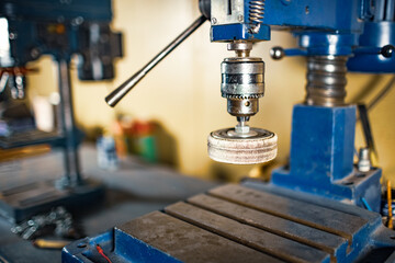 Drilling machine at the workplace of a toolman locksmith