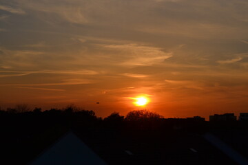 Sunset with reddish and blue clouds in central Europe